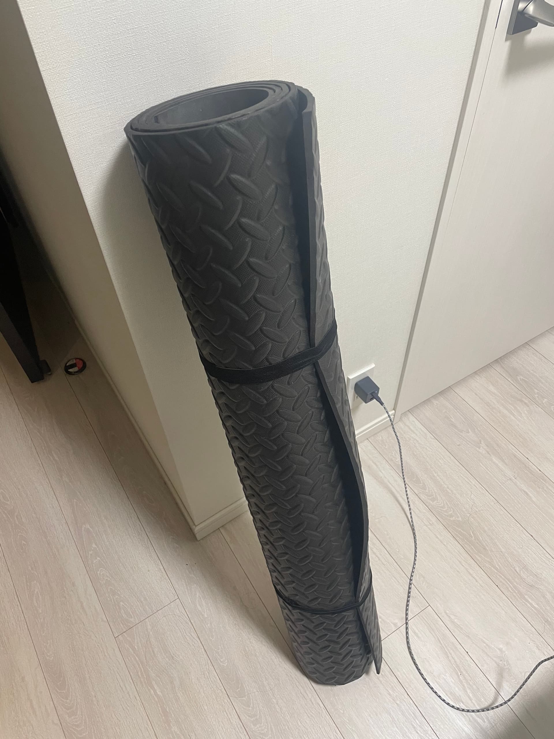 A Large exercise mat rolled up